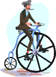 A man on a Penny Farthing bicycle.