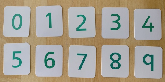 ten cards showing the numbers 0, 1, 2, 3, 4, 5, 6, 7, 8 and 9