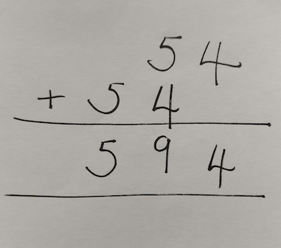 column addition with 54 as the first number, then 54 written again below, but with the 5 in the hundreds column and the 4 in the tens column. The answer written is 594