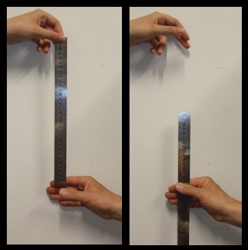 hand holding ruler