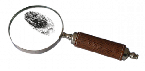 A magnifying glass over an inky fingerprint.