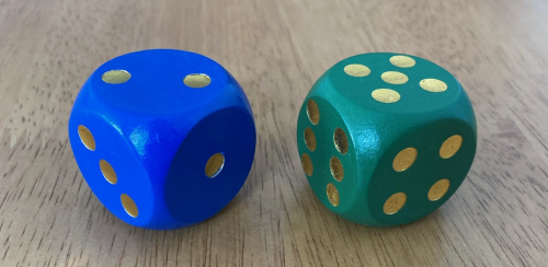Two dice. The left dice has 2 dots on top, and the right dice has 5 dots on top.