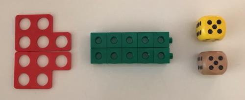 Two red Numicon shapes representing 5 each; two green stacks of 5 connecting cubes; and two dice, each showing 5.