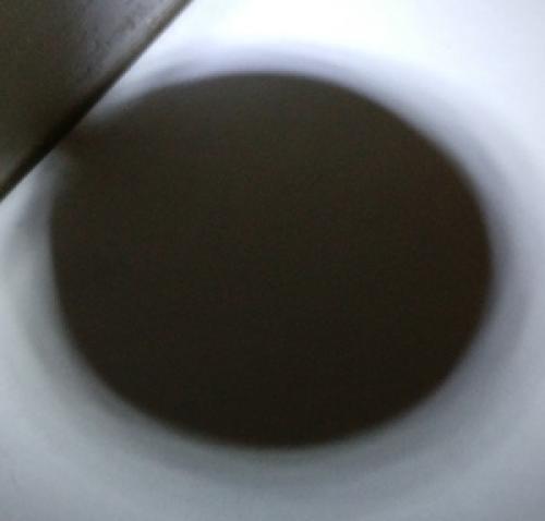 A circular shadow.