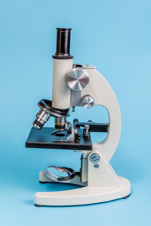 A microscope with a blue background.
