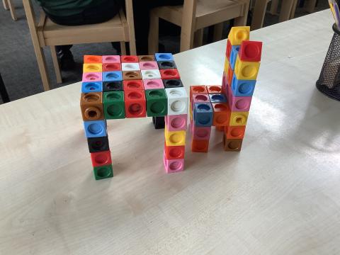 A table and chair made from interlocking cubes