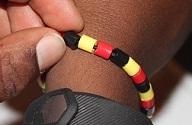 Pattern Making Bead bracelet in black, yellow, and red.