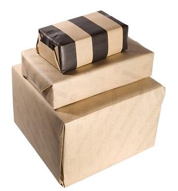 Wrapping Parcels A stack of boxes wrapped in brown paper. The wrapping paper of the top box has black stripes.