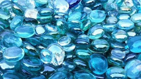 Hidden Jewels A pile of shiny blue pebbles or counters.