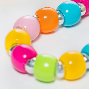 A section of a bracelet made of colourful beads.