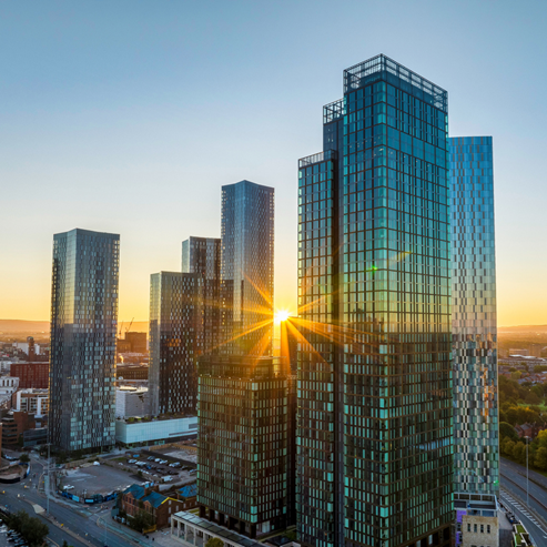 Sunrise over some tower blocks.