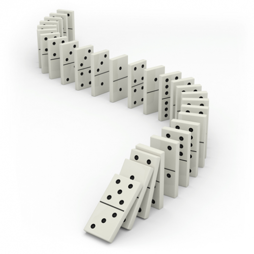 A row of dominoes falling over.