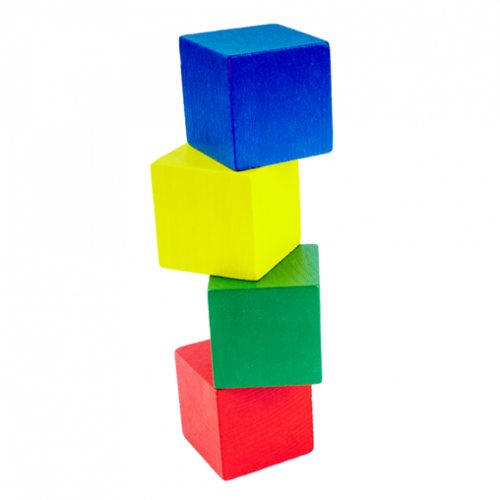 Four coloured wooden cubes balanced precariously to make a tower.