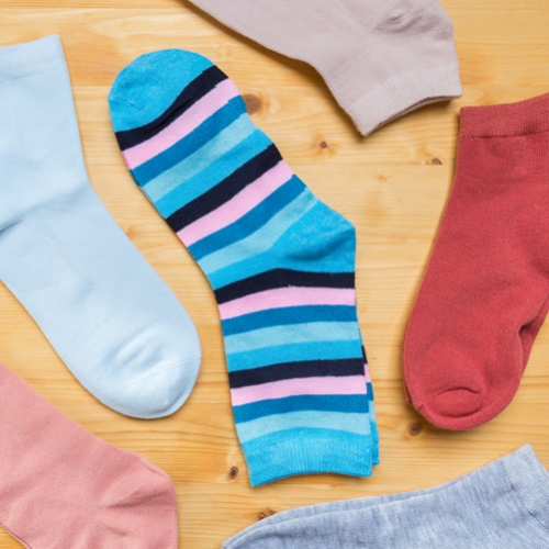 Multicoloured socks lying next to each other.