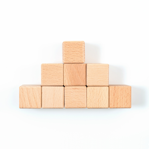 Wooden cubes arranged in rows of one, three and five.