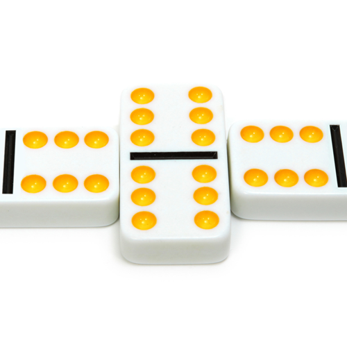 A double six domino with two sixes on other dominoes touching its sides.