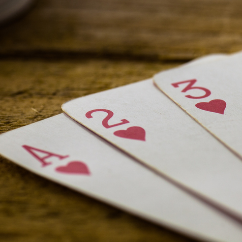 The ace, two and three of hearts.
