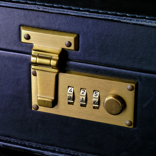 A combination lock on a briefcase.