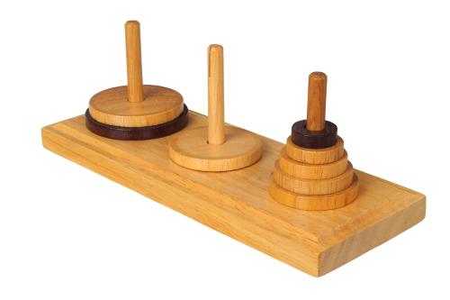 The towers of Hanoi, which is a game where wooden rings are placed on three poles.