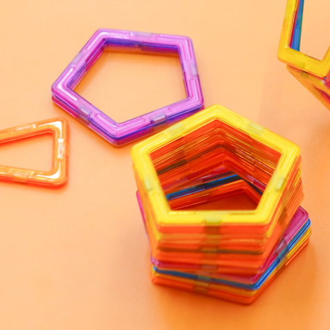 A stack of colourful plastic pentagons.