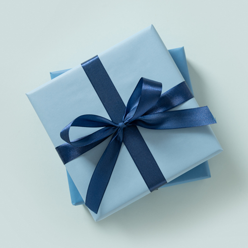 Two stacked presents with blue wrapping paper.
