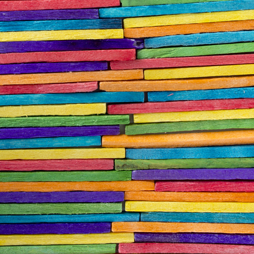 Coloured craft matchsticks of different colours.