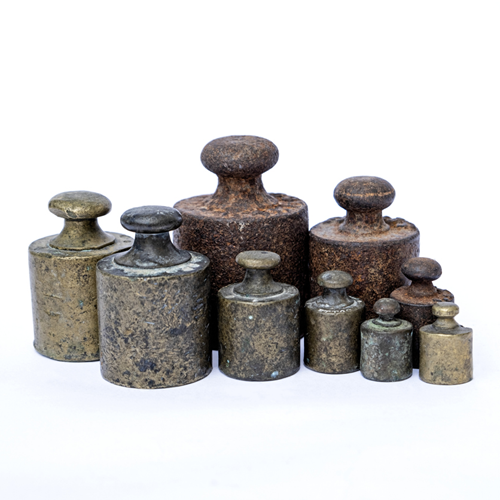 A set of old-fashioned iron weights.