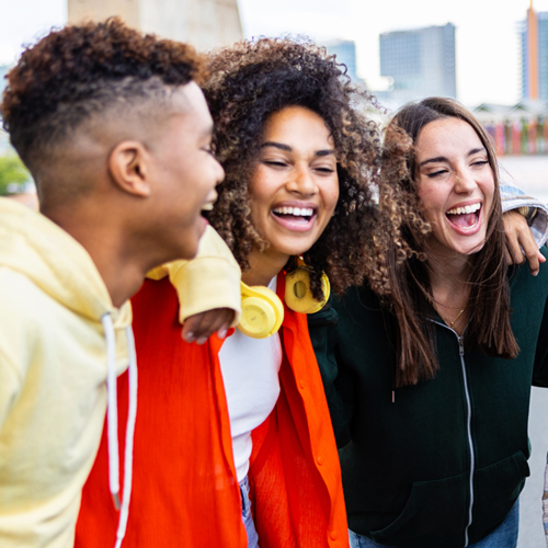 A group of laughing teenagers.