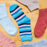 Multicoloured socks lying next to each other.