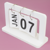 The date January 7th on a flip calendar, with a purple background.