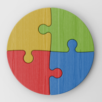 Four different coloured puzzle pieces put together to make a circle.