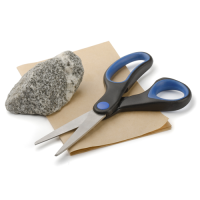 A pair of scissors and a grey rock on a piece of brown paper.